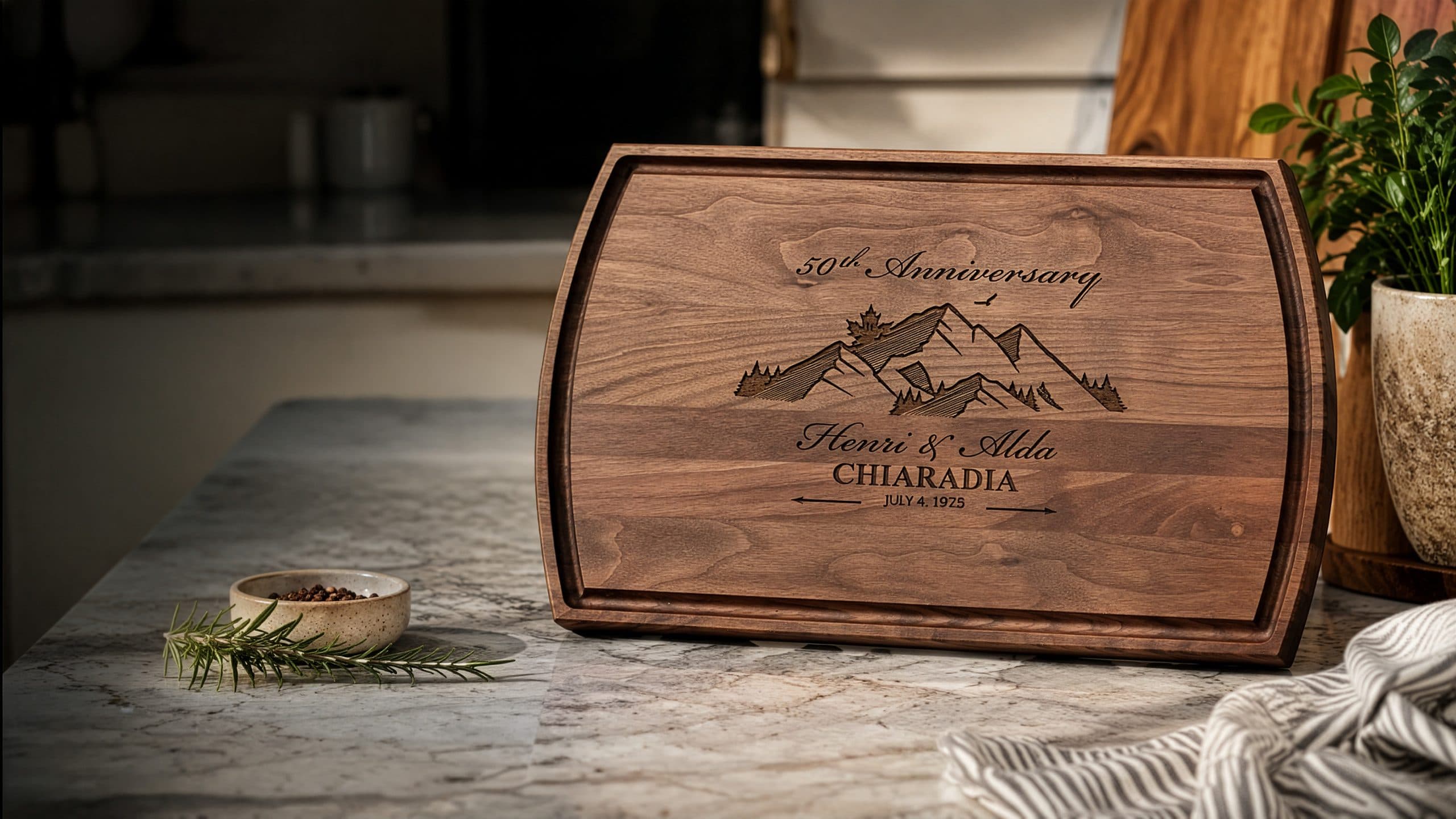 Walnut cutting board engraved with a mountain anniversary design